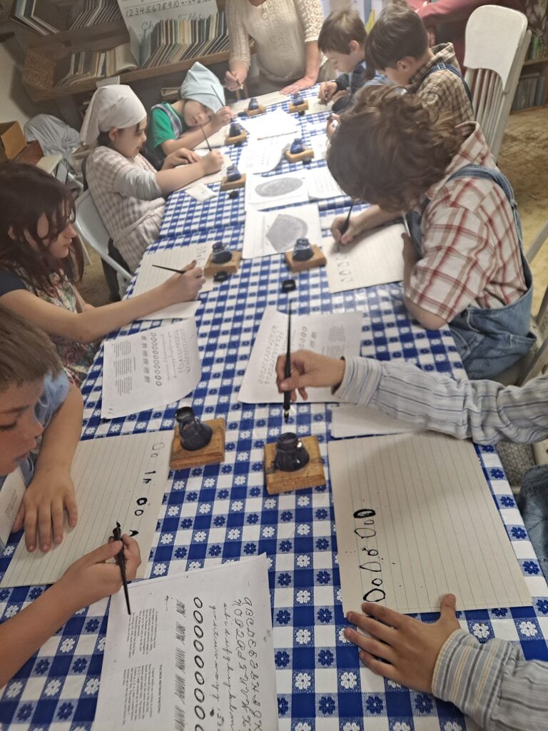 Students writing with dip pen & ink